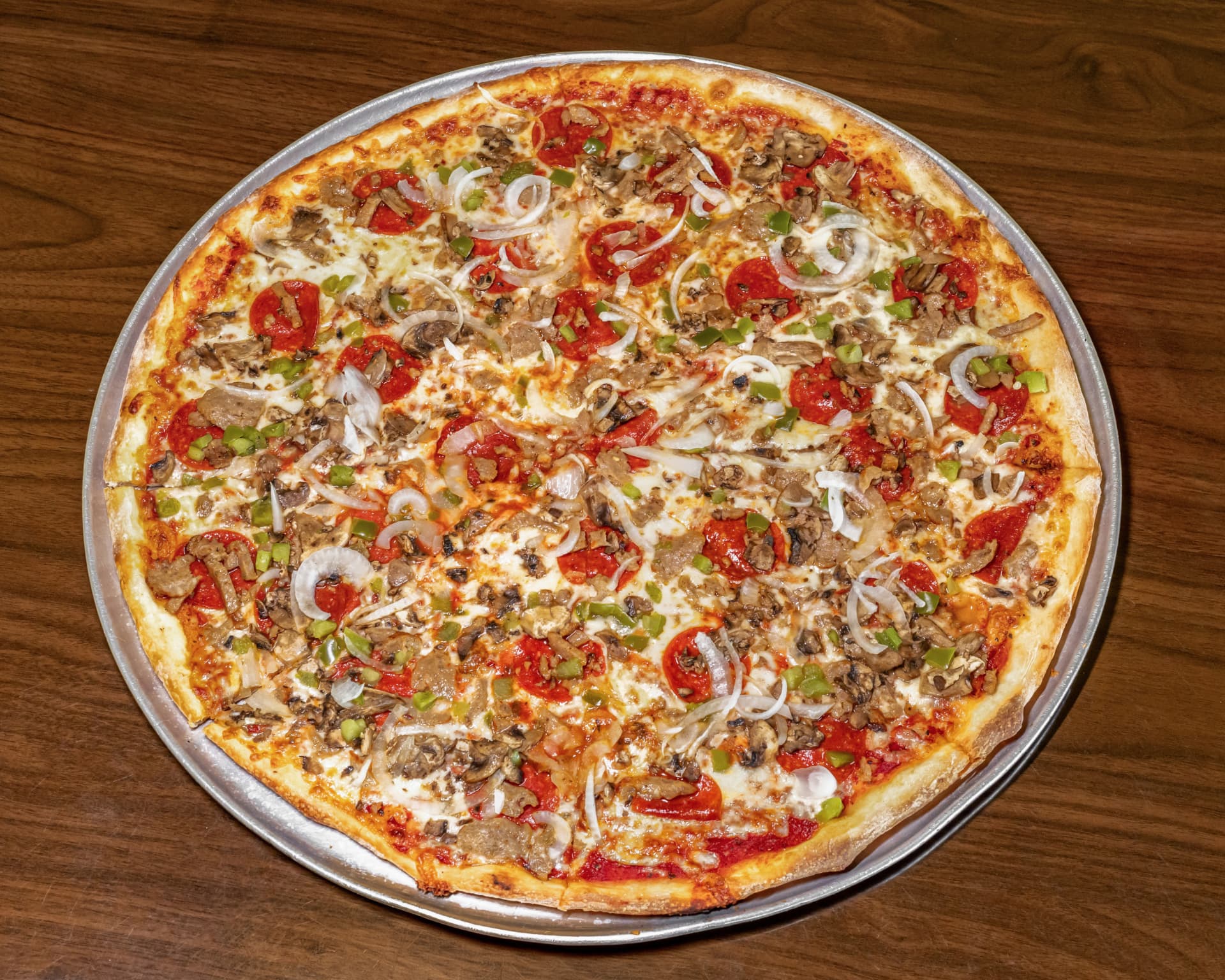 The Works pizza with pepperoni, sausage, peppers and mushrooms