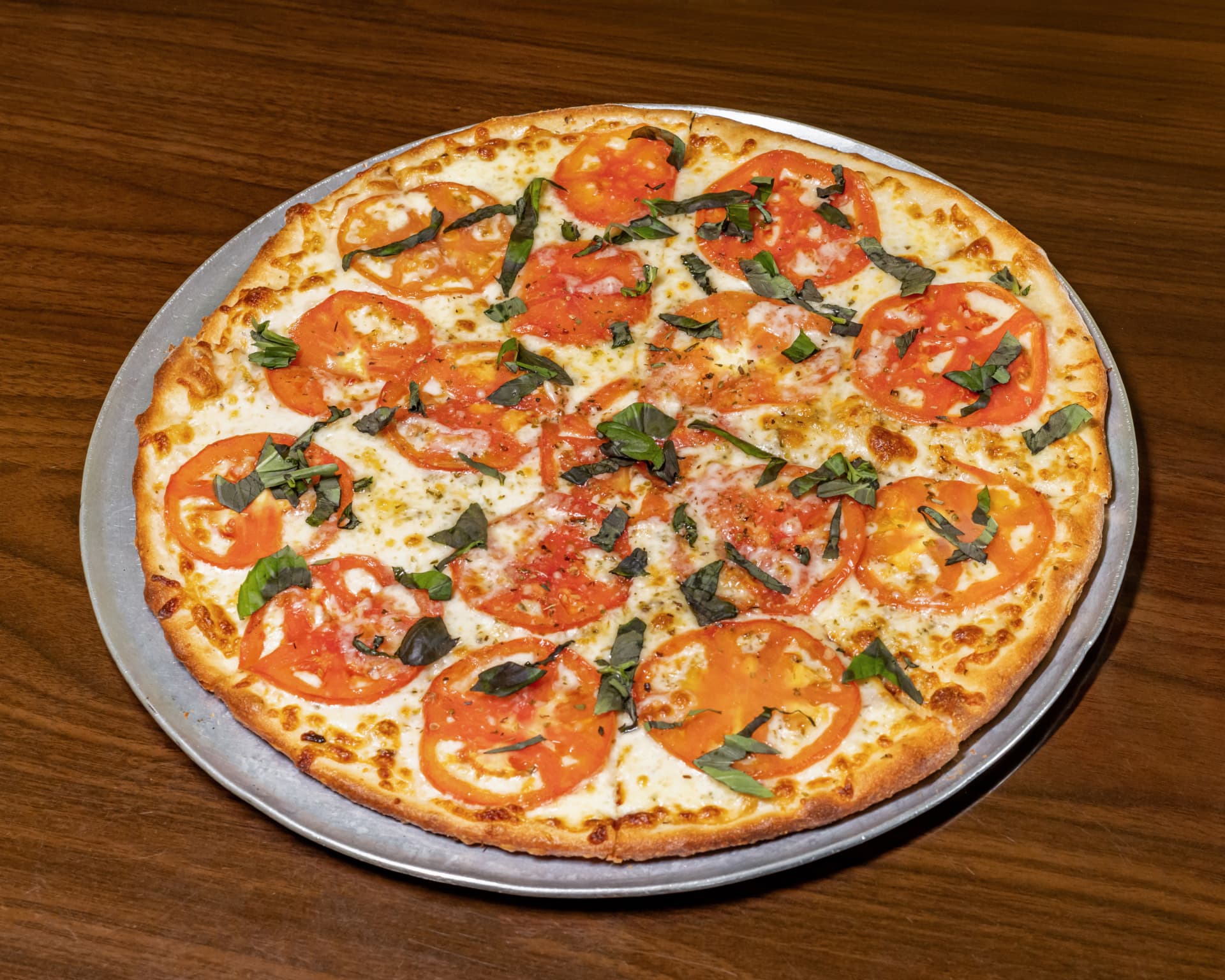 Margherita pizza with fresh tomatoes and basil